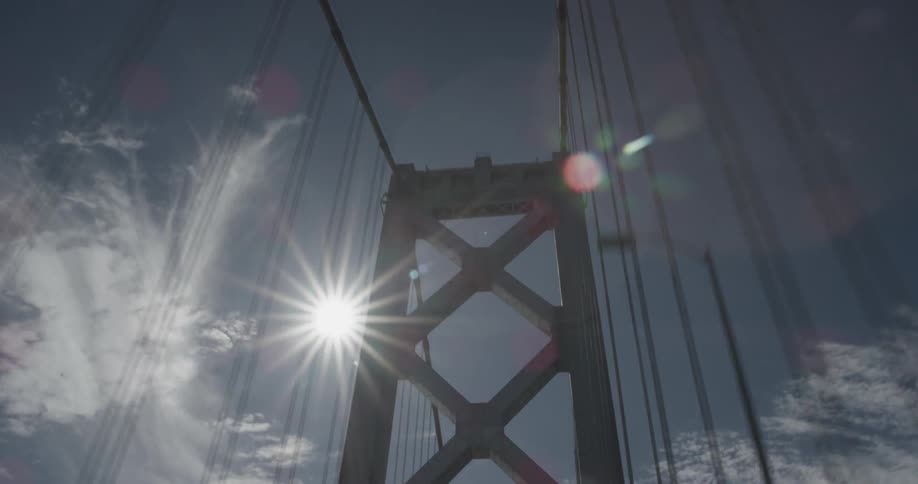 Riding through a bridge at noon