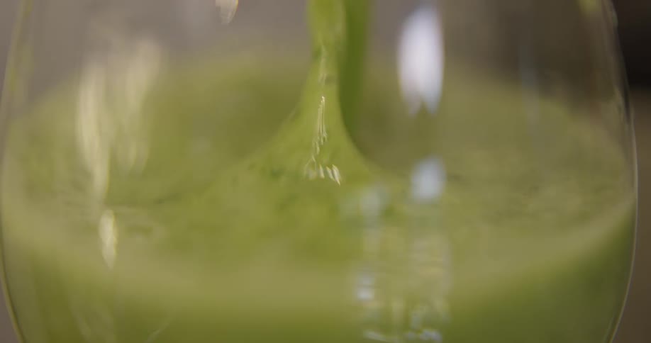 Liquid is being poured into a glass
