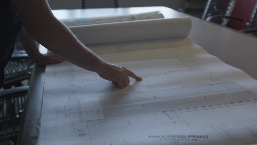 A person is looking at diagrams