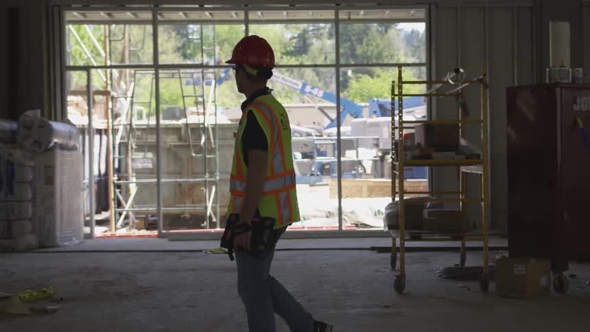 A man walking around a construction site