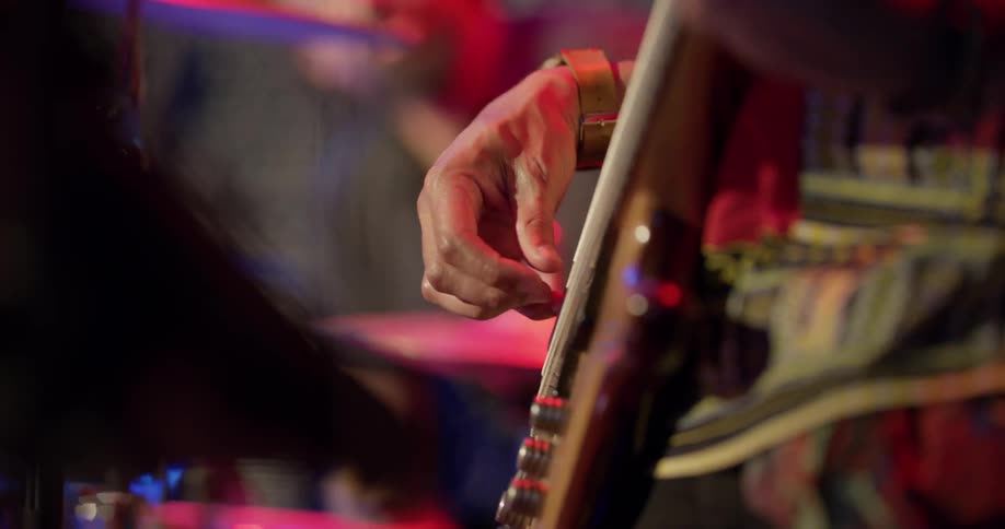 Someone plays a guitar