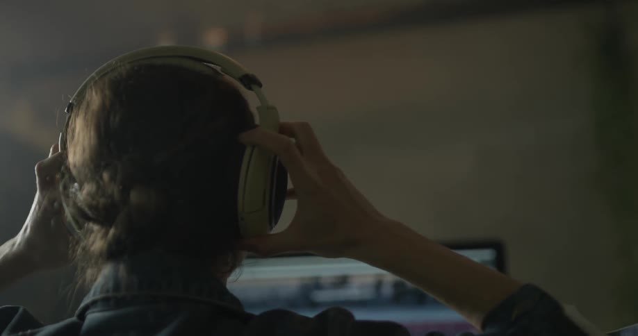 Woman Working On Computer In Studio
