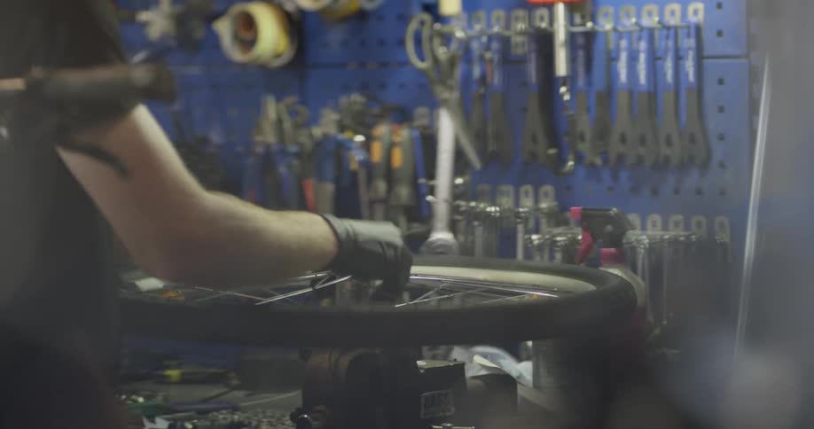 A person is fixing a bicycle tire