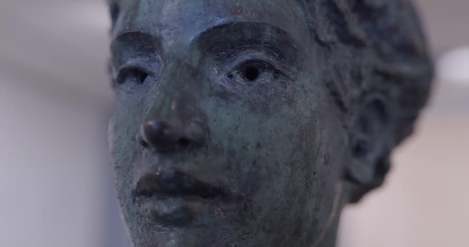 Statue of a face illuminated by bright light