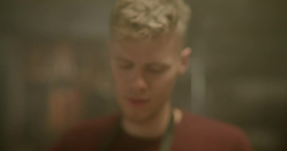 A man is looking around inside