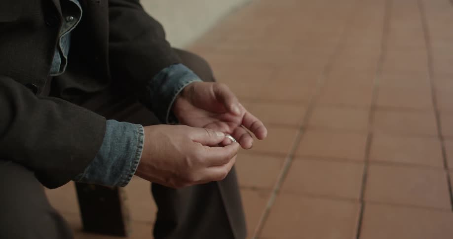 A man playing with his ring