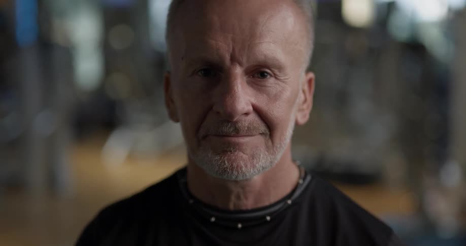 A man stares half-smiling at the camera