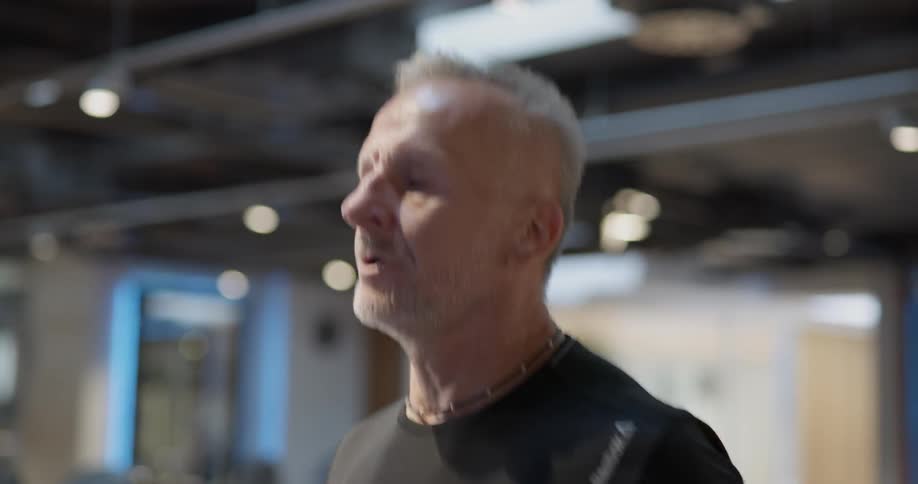 A man is jogging indoors