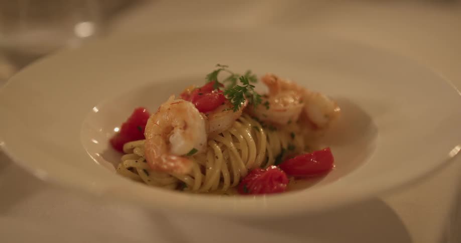 A bowl of shrimp and pasta