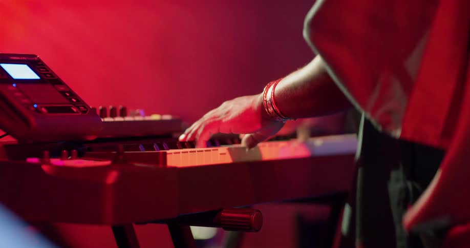A person playing an electronic keyboard