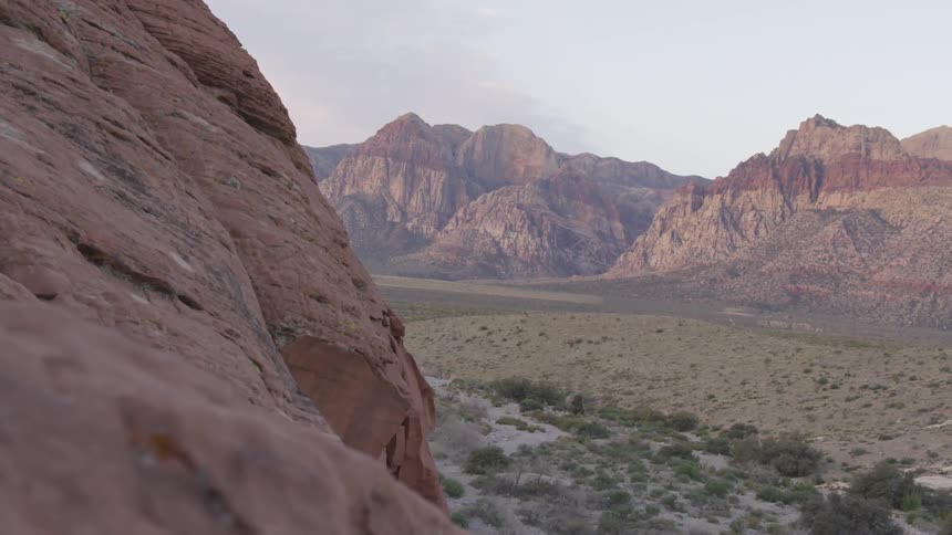 A valley between painted rock mountains