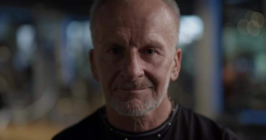 An elderly man smiles