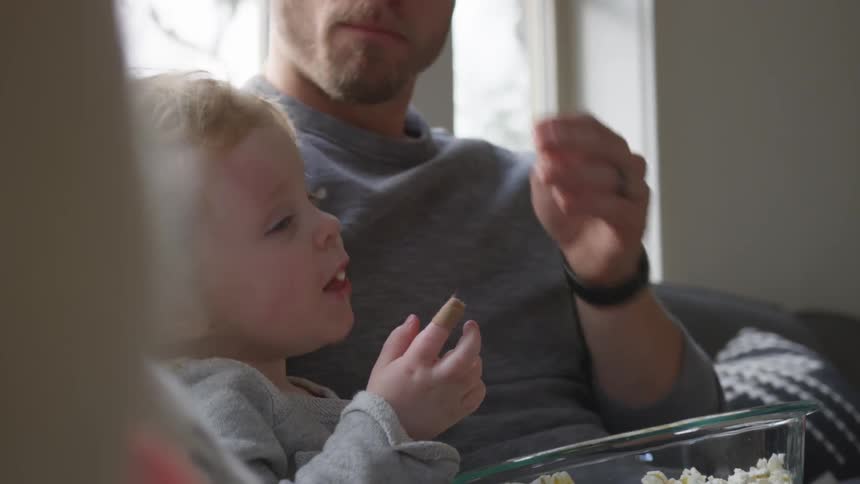 Father And Daughter Playing At Home