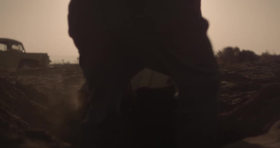 A person moving a crate
