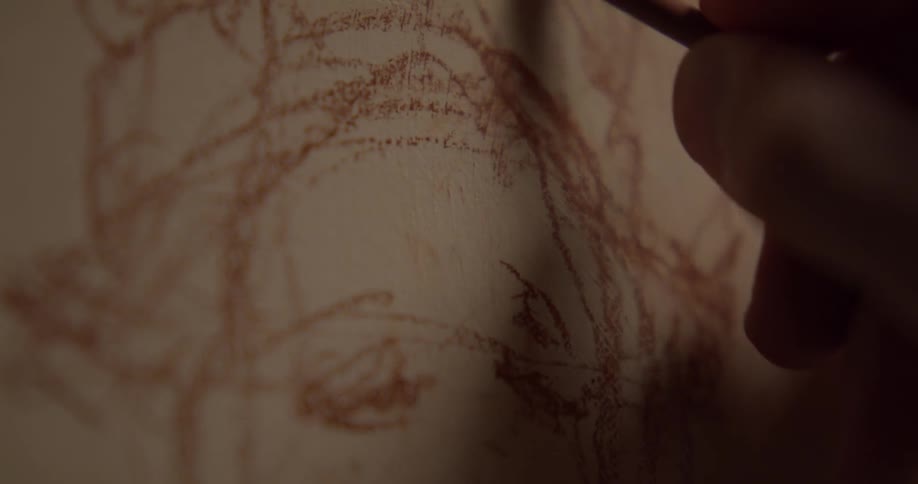 A person is drawing on a canvas