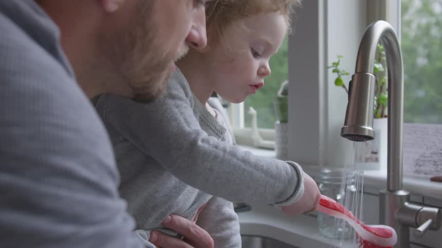 Father And Daughter Playing At Home