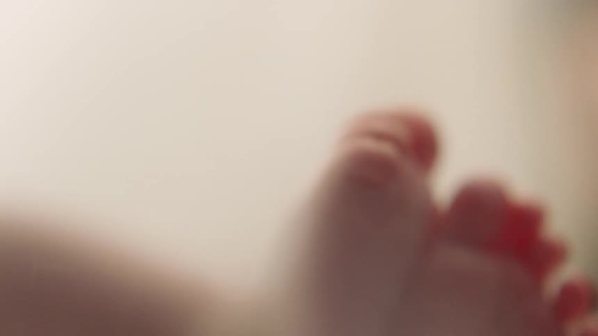 A baby is moving its feet