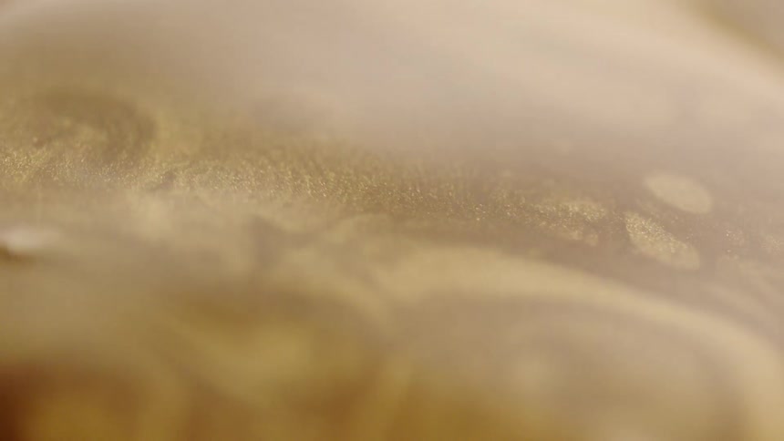 Coffee dripping into a cup