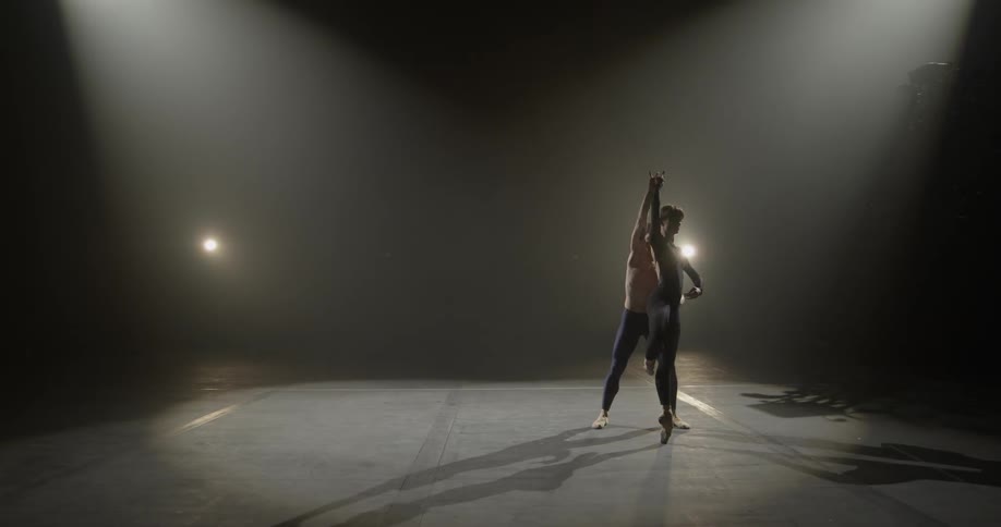 A couple dancing in the darkness