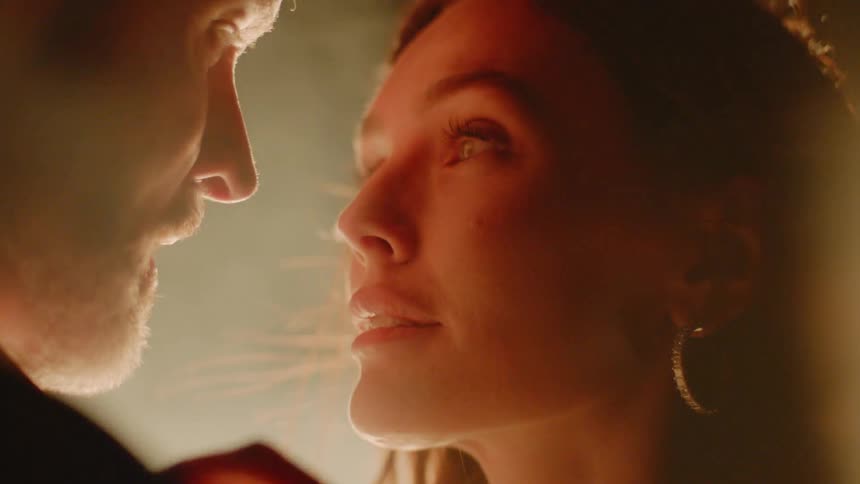 A woman and man are staring at each other