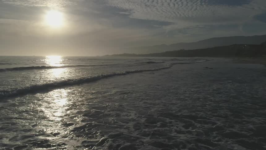 The sun shines off of the ocean