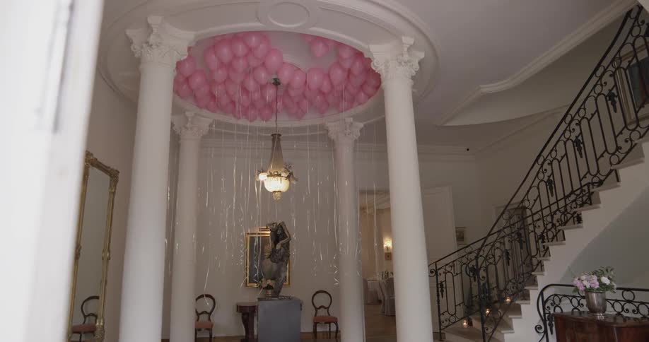 A room is decorated with balloons
