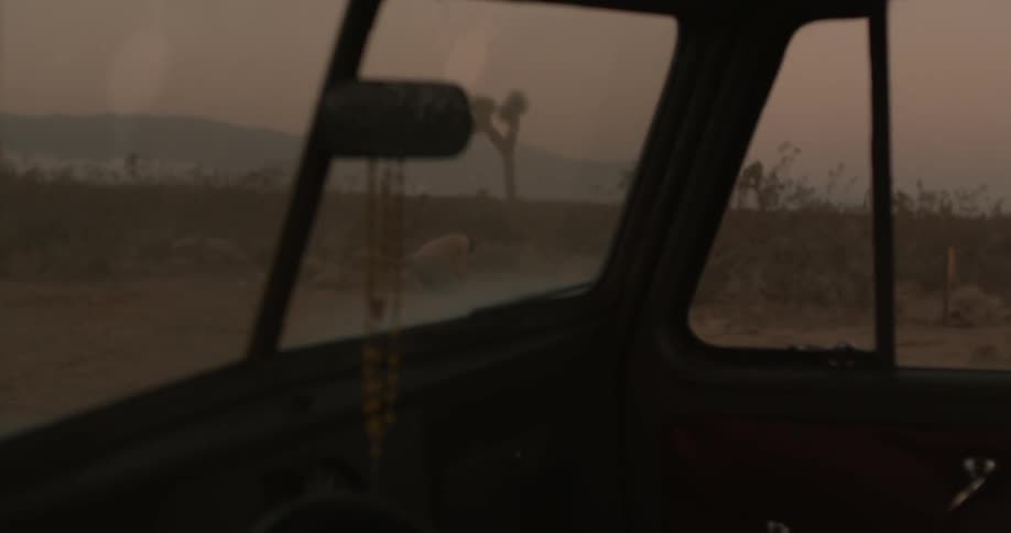 Beads hanging from a rear view mirror