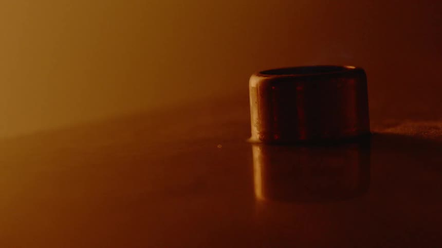 An abstract image of a metal piece on a surface