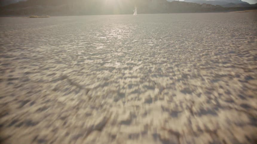 Sun shines over a large flat desert