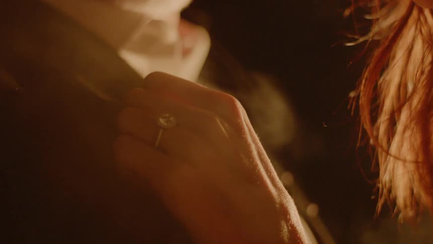 Couple Kissing By Fire In Desert