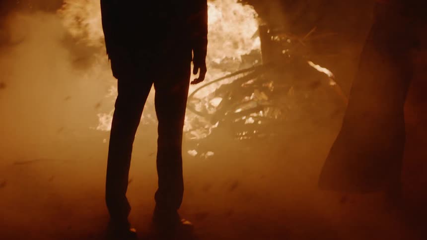 Couple Kissing By Fire In Desert
