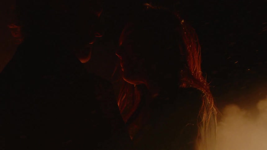 A woman and man are staring at each other