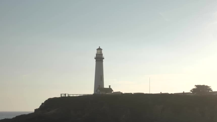 A lighthouse along the water