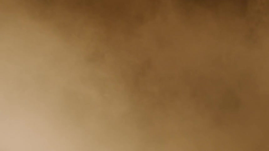 A man and woman are by smoke