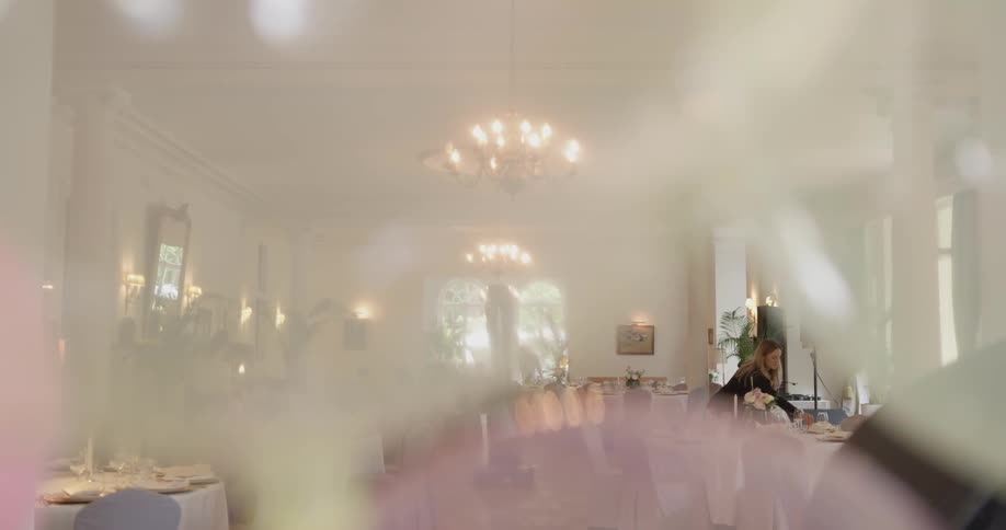 A woman walking through a restaurant