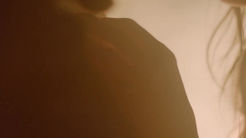 Man and a woman standing in a very foggy area