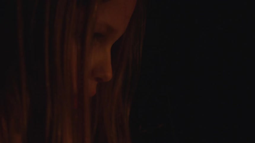 A child is indoors at night