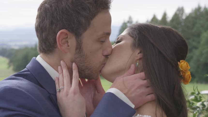 A man and woman kissing in a wedding