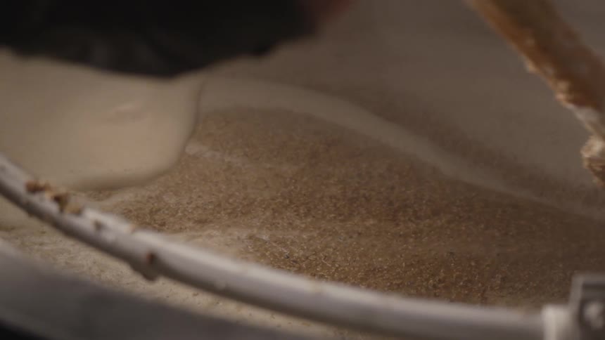 A thick creamy mixture being stirred