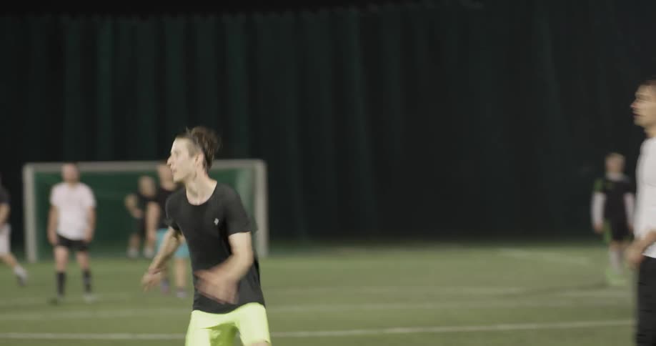 People are playing soccer together