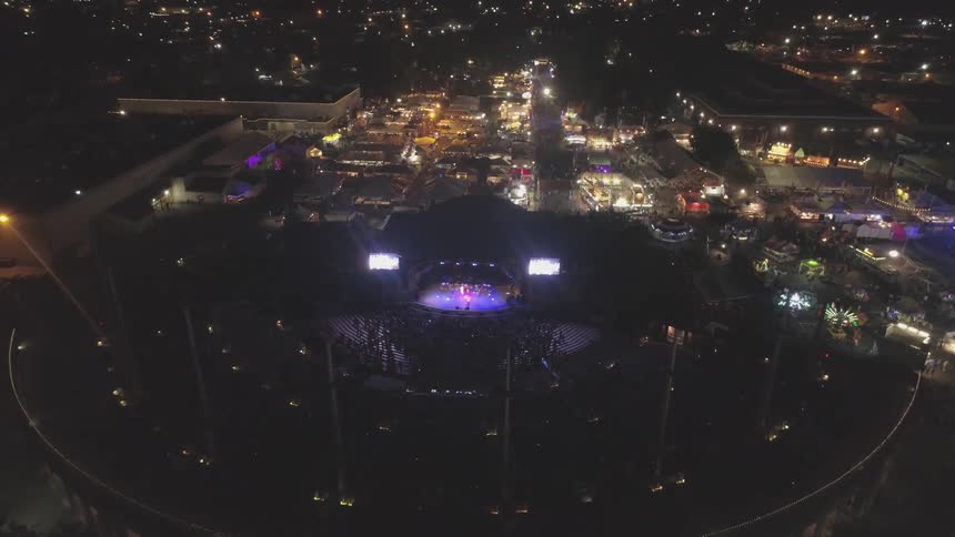 Lights are flashing is stadium in city at night