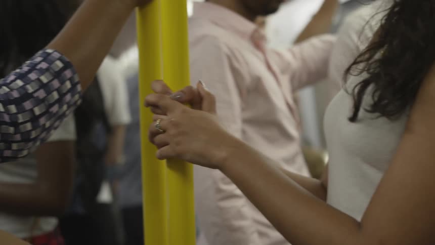 People standing in a moving subway
