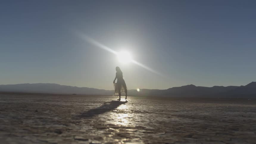 Couple Dancing In The Desert