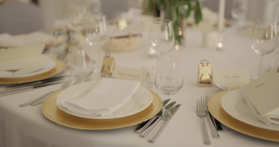 There are plates, napkins, and utensils on the table