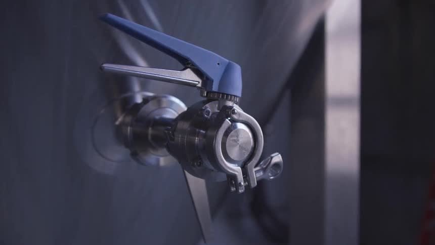 The valve on a vat in a brewery