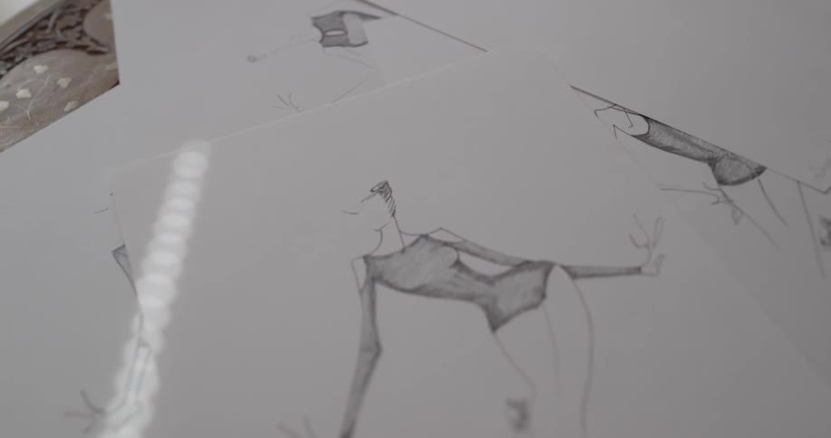 Sketches are drawn on pieces of paper