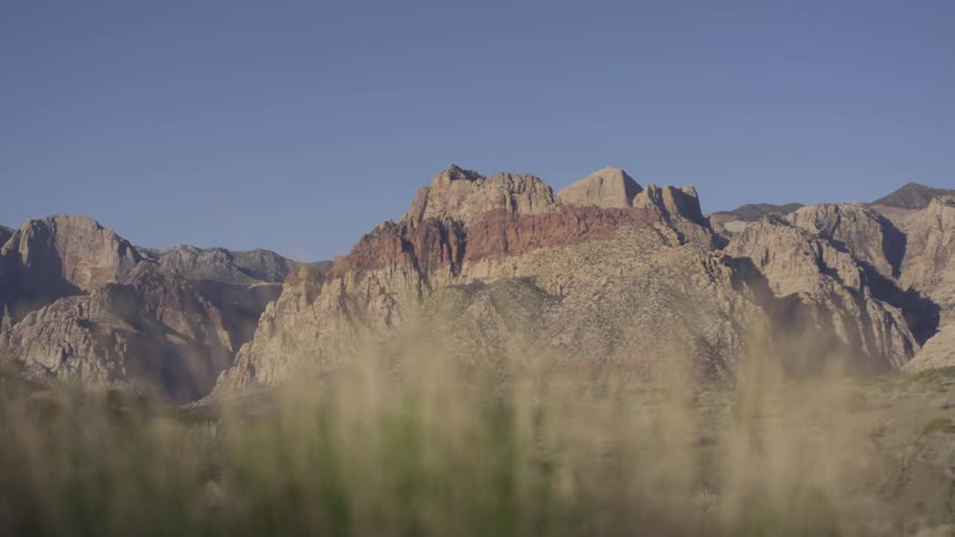 A mountain range that has a red line on rocks