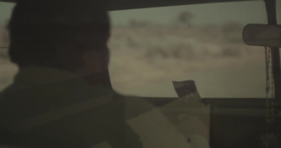 A person driving a vehicle