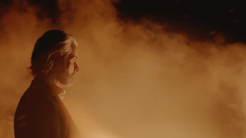 Couple Kissing By Fire In Desert
