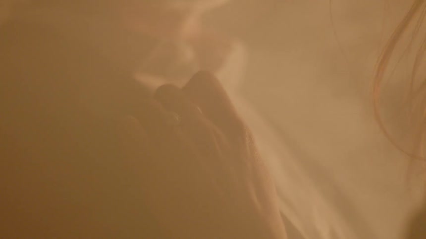 A woman touching a man's lapel